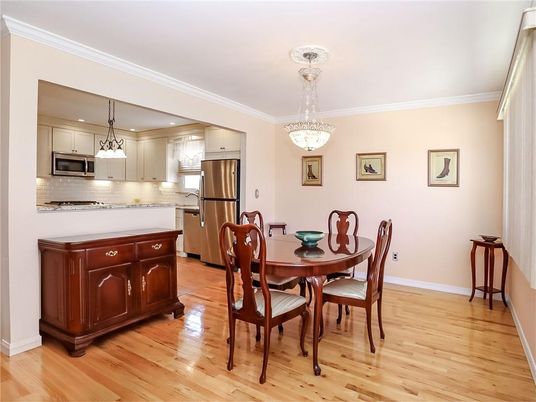 Chandelier, Dining room, Interior, Kitchen, Pendant Lights, Recessed Lighting, Stainless Steel Appliances, Wood Texture Flooring