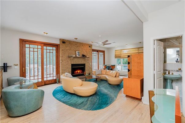 Fireplace, Interior, Living room, Recessed Lighting, Stone Walls, Wood Texture Flooring