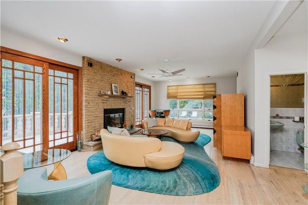 Fireplace, Interior, Living room, Recessed Lighting, Stone Walls, Wood Texture Flooring