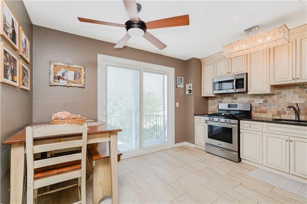 Chandelier, Dining room, Interior, Kitchen, Stainless Steel Appliances, Wood Texture Flooring