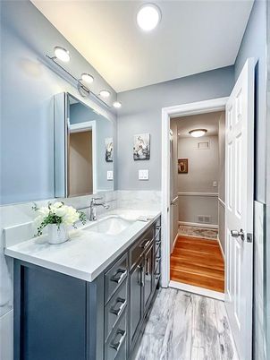 Bathroom, Dual Sink Vanities, Interior, Marble, Recessed Lighting, Wood Texture Flooring