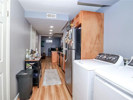 Interior, Kitchen, Recessed Lighting, Washer, Wood Texture Flooring