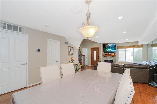 Dining room, Fireplace, Interior, Living room, Pendant Lights, Recessed Lighting, Wood Texture Flooring