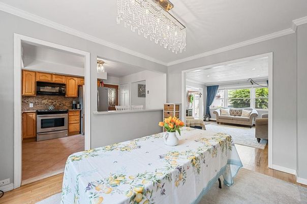 Chandelier, Dining room, Interior, Kitchen, Living room, Stainless Steel Appliances, Wood Texture Flooring