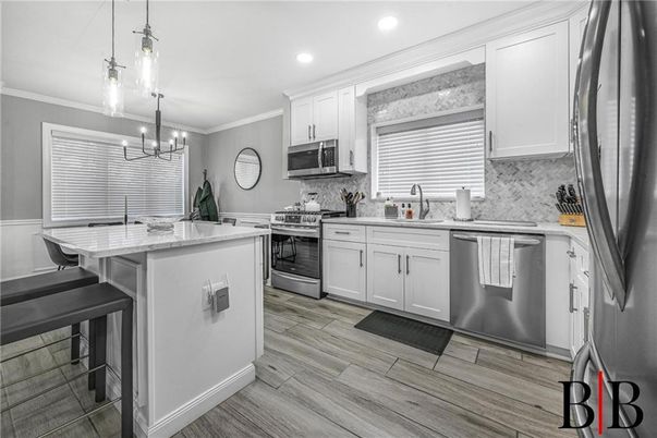 Chandelier, Interior, Kitchen, Pendant Lights, Recessed Lighting, Stainless Steel Appliances, Wood Texture Flooring