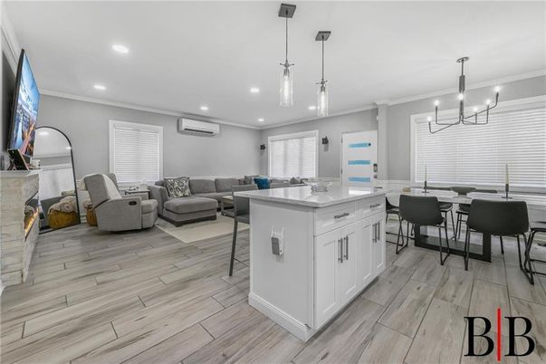 Chandelier, Dining room, Fireplace, Interior, Kitchen, Living room, Pendant Lights, Recessed Lighting, Wood Texture Flooring