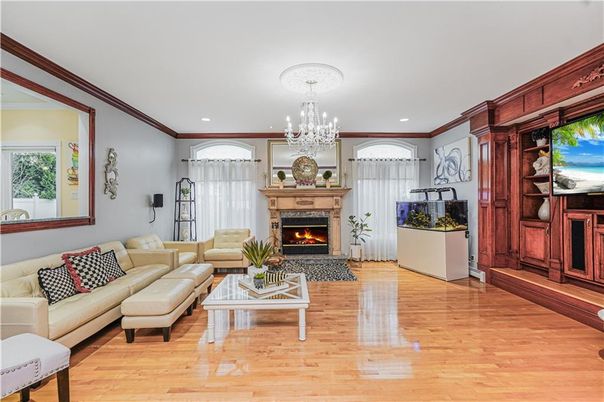 Chandelier, Fireplace, Interior, Living room, Recessed Lighting, Wood Texture Flooring