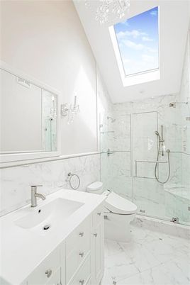 Bathroom, Dual Sink Vanities, Glass Ceilings, Glass Shower, Interior, Marble, Marble Walls, Recessed Lighting