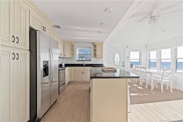 Dining room, Interior, Kitchen, Recessed Lighting, Stainless Steel Appliances, Water, Wood Texture Flooring