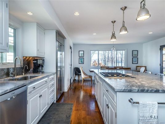 Dining room, Interior, Kitchen, Pendant Lights, Recessed Lighting, Stainless Steel Appliances, Wood Texture Flooring