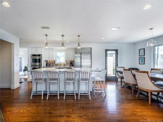 Dining room, Interior, Kitchen, Pendant Lights, Recessed Lighting, Stainless Steel Appliances, Wood Texture Flooring