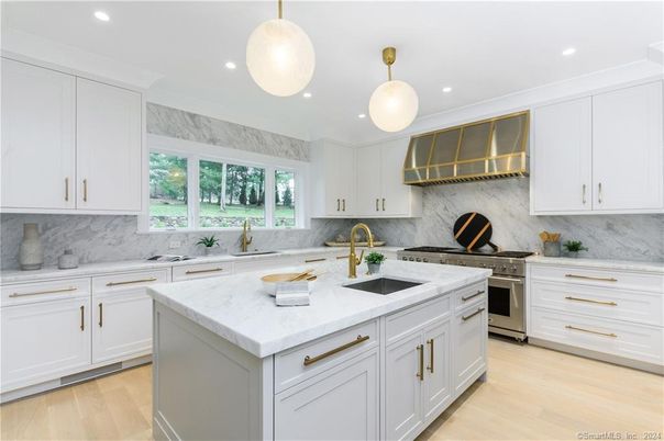 Interior, Kitchen, Marble Walls, Pendant Lights, Recessed Lighting, Stainless Steel Appliances, Wood Texture Flooring