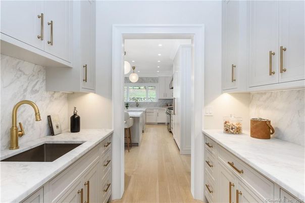 Interior, Kitchen, Marble Walls, Pendant Lights, Recessed Lighting, Wood Texture Flooring