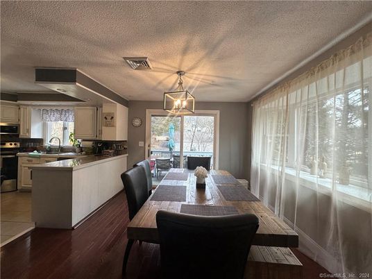 Dining room, Interior, Kitchen, Pendant Lights, Stainless Steel Appliances, Wood Texture Flooring