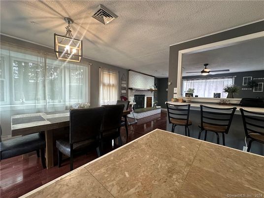 Dining room, Fireplace, Interior, Pendant Lights, Wood Texture Flooring