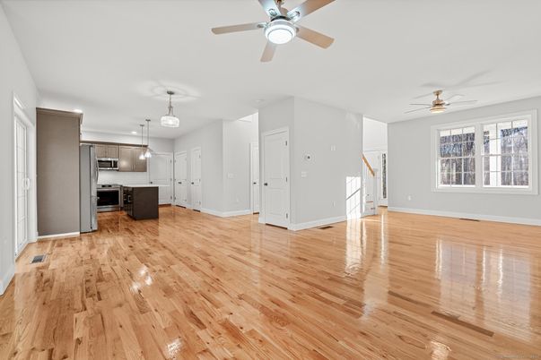 Empty room, Interior, Kitchen, Pendant Lights, Stainless Steel Appliances, Wood Texture Flooring