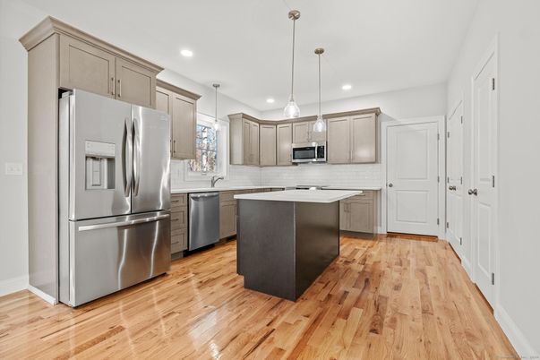 Interior, Kitchen, Pendant Lights, Recessed Lighting, Stainless Steel Appliances, Wood Texture Flooring