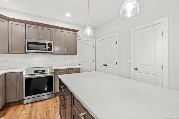 Interior, Kitchen, Pendant Lights, Recessed Lighting, Stainless Steel Appliances, Wood Texture Flooring
