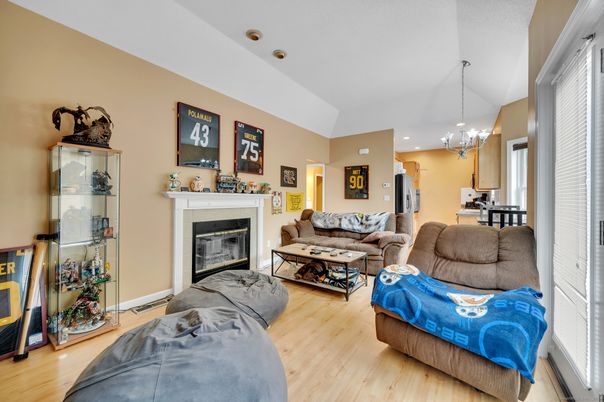 Chandelier, Dining room, Fireplace, Interior, Living room, Pendant Lights, Recessed Lighting, Wood Texture Flooring