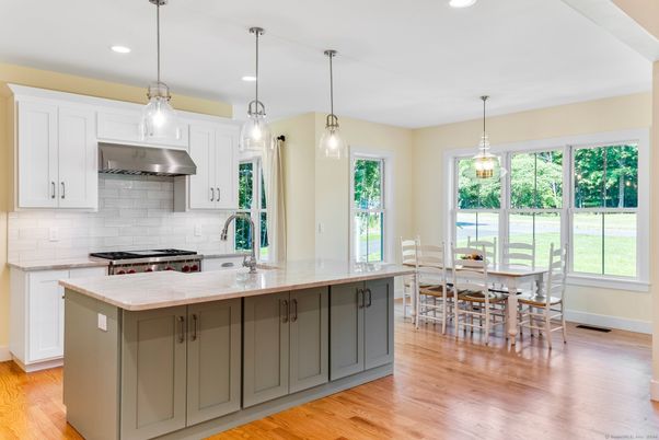 Dining room, Interior, Kitchen, Pendant Lights, Recessed Lighting, Stainless Steel Appliances, Wood Texture Flooring