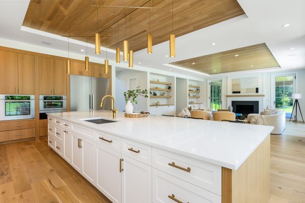 Fireplace, Interior, Kitchen, Living room, Pendant Lights, Recessed Lighting, Stainless Steel Appliances, Wooden Ceilings, Wood Texture Flooring