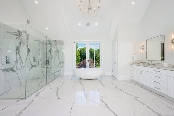 Bathroom, Dual Sink Vanities, Free Standing Baths, Glass Shower, Interior, Marble, Marble Walls, Recessed Lighting