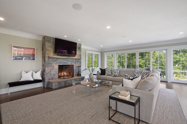 Fireplace, Interior, Living room, Recessed Lighting, Stone Walls, Wood Texture Flooring