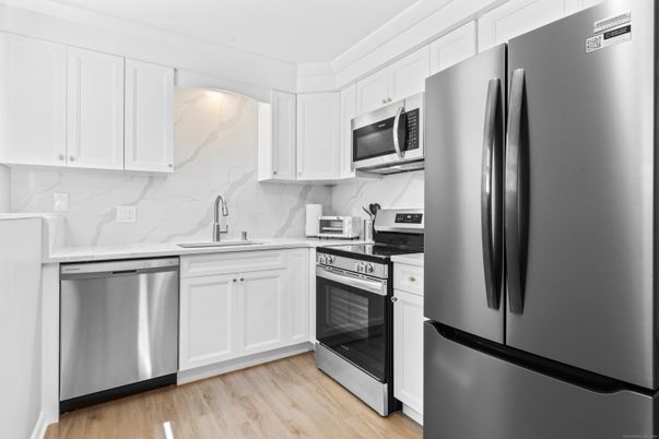 Interior, Kitchen, Marble Walls, Stainless Steel Appliances, Wood Texture Flooring