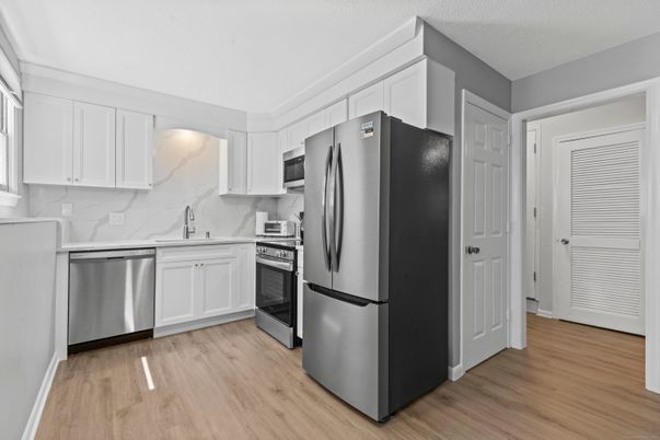 Interior, Kitchen, Marble Walls, Stainless Steel Appliances, Wood Texture Flooring