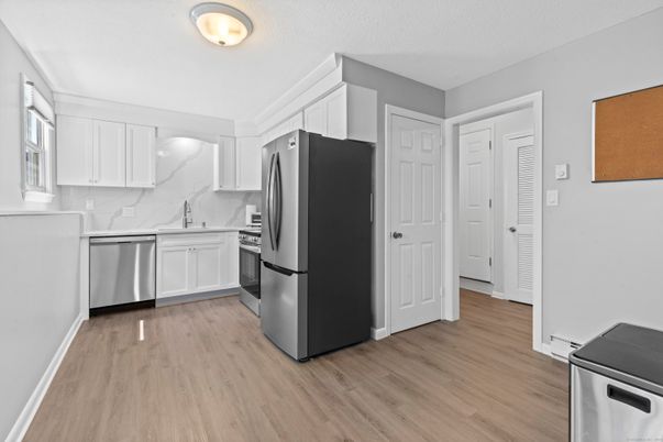 Interior, Kitchen, Marble Walls, Stainless Steel Appliances, Wood Texture Flooring