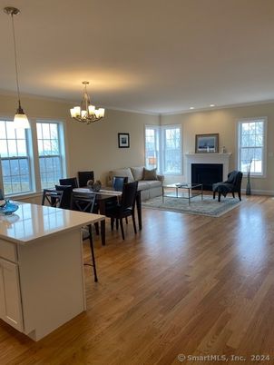 Chandelier, Dining room, Fireplace, Interior, Kitchen, Living room, Pendant Lights, Recessed Lighting, Wood Texture Flooring