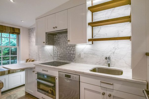 Interior, Kitchen, Marble Walls, Recessed Lighting, Stainless Steel Appliances