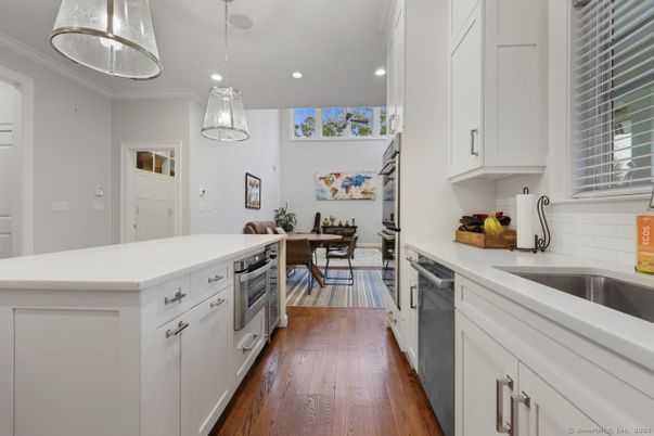 Dining room, Interior, Kitchen, Pendant Lights, Recessed Lighting, Stainless Steel Appliances, Wood Texture Flooring