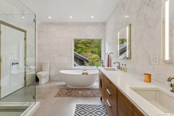 Bathroom, Dual Sink Vanities, Free Standing Baths, Glass Shower, Interior, Marble Walls, Recessed Lighting