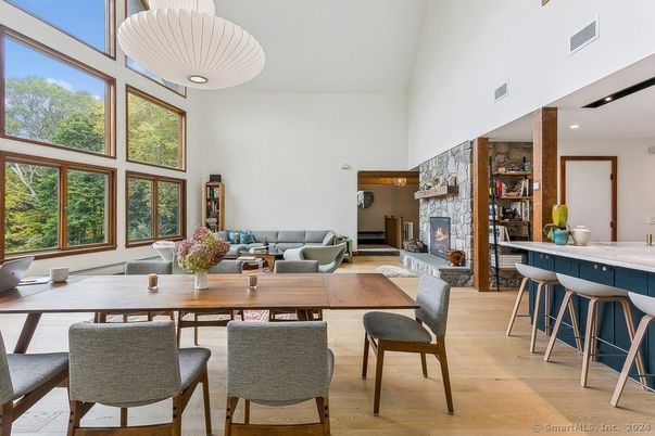 Dining room, Fireplace, Interior, Living room, Pendant Lights, Recessed Lighting, Stone Walls, Wood Texture Flooring