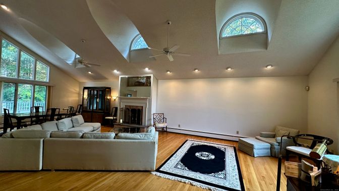 Dining room, Fireplace, Interior, Living room, Recessed Lighting, Wood Texture Flooring