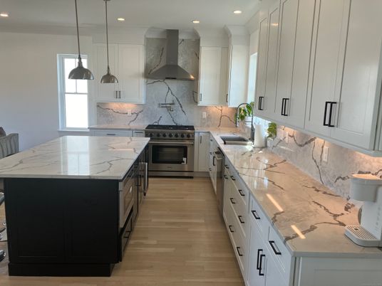 Interior, Kitchen, Marble Walls, Pendant Lights, Recessed Lighting, Stainless Steel Appliances, Wood Texture Flooring