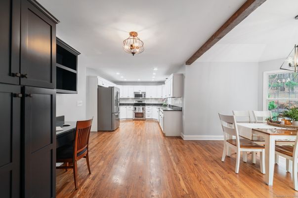 Chandelier, Dining room, Interior, Kitchen, Recessed Lighting, Stainless Steel Appliances, Wooden Beams, Wood Texture Flooring