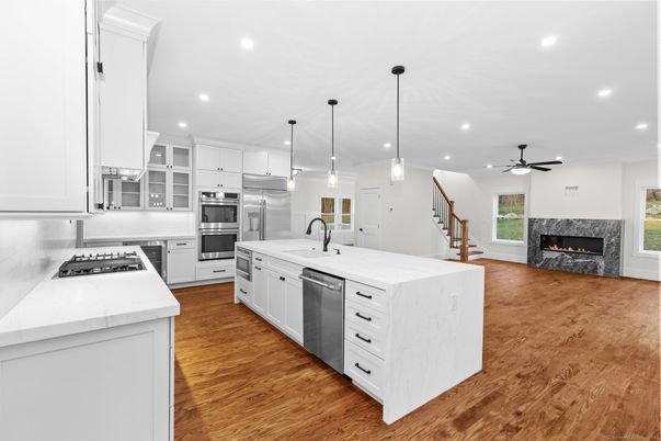 Fireplace, Interior, Kitchen, Pendant Lights, Recessed Lighting, Stainless Steel Appliances, Wood Texture Flooring