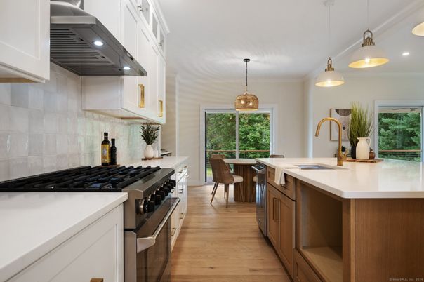 Dining room, Interior, Kitchen, Pendant Lights, Recessed Lighting, Stainless Steel Appliances, Wood Texture Flooring