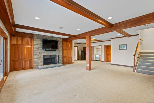 Empty room, Fireplace, Interior, Recessed Lighting, Stone Walls, Wooden Beams