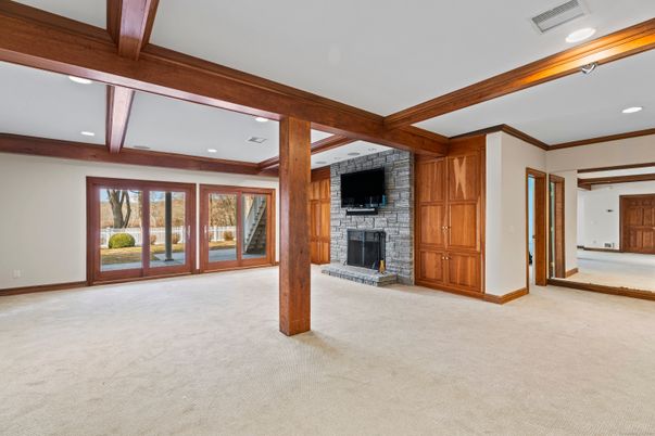 Empty room, Fireplace, Interior, Recessed Lighting, Stone Walls, Wooden Beams