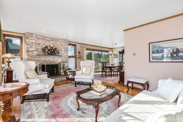 Chandelier, Dining room, Fireplace, Interior, Living room, Stone Walls, Wood Texture Flooring