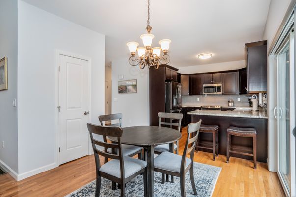 Chandelier, Dining room, Interior, Kitchen, Stainless Steel Appliances, Wood Texture Flooring