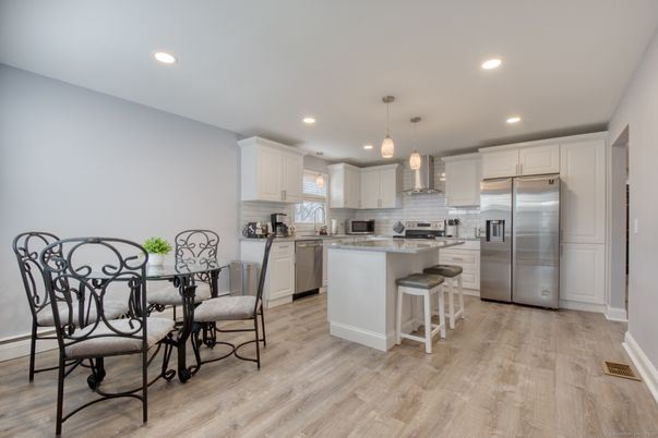 Dining room, Interior, Kitchen, Pendant Lights, Recessed Lighting, Stainless Steel Appliances, Wood Texture Flooring