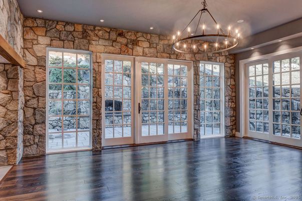 Chandelier, Empty room, Interior, Recessed Lighting, Stone Walls, Wood Texture Flooring