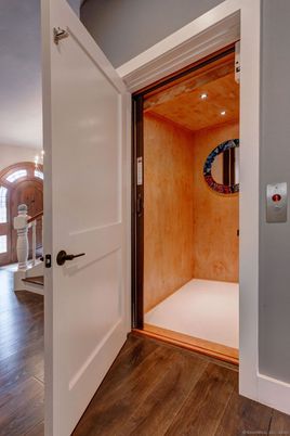 Elevator, Interior, Recessed Lighting, Wood Texture Flooring
