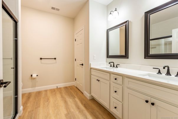 Bathroom, Dual Sink Vanities, Interior, Recessed Lighting, Wood Texture Flooring