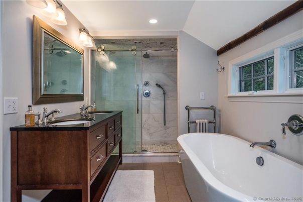 Bathroom, Dual Sink Vanities, Free Standing Baths, Glass Shower, Interior, Marble Walls, Recessed Lighting