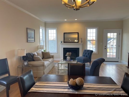 Chandelier, Dining room, Fireplace, Interior, Living room, Recessed Lighting, Wood Texture Flooring